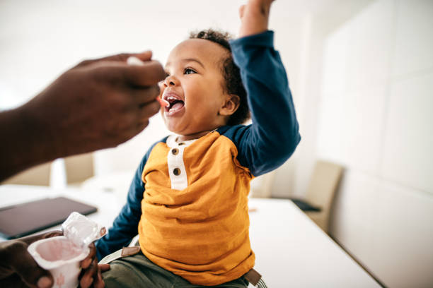 istock Toddler eating yogurt 1173222609