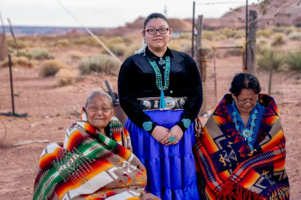 Native American Navajo Women, Teenage Granddaughter, Grandmother and Great Grandma Outside a Traditional Navajo Home in Monument Valley on the Arizona Utah Border