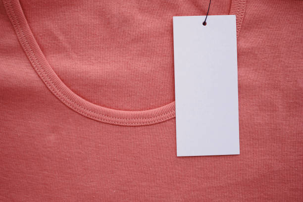 istock Blank white clothes tag label on new shirt 1173222783