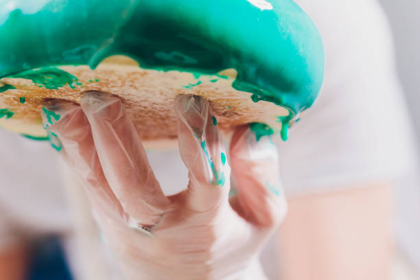 istock Confectioner makes a wedding cake with confectionery bag at kitchen. 1173223215