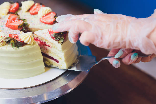 istock Vanilla ice cream cake with strawberry on top macro. 1173223218