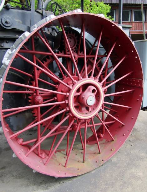 istock Red wheel of an old steam-powered tractor 1173229369