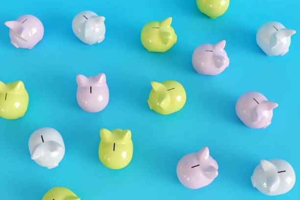 istock Many Piggy Bank on blue background. top view. minimal concept ideas.