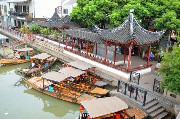 istock Old village by river in Shanghai with boat 1173230134