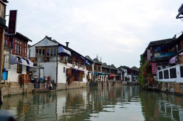 istock Old village by river in Shanghai with boat 1173230186