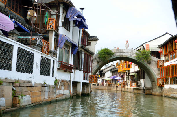 istock Old village by river in Shanghai with boat 1173230190