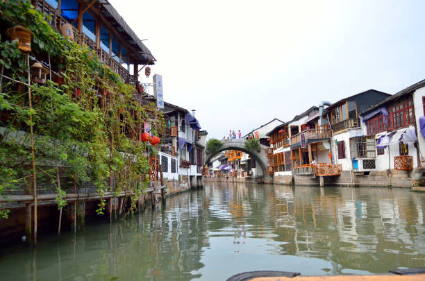 istock Old village by river in Shanghai with boat 1173230207