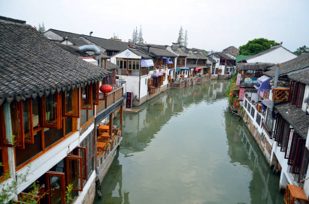 istock Old village by river in Shanghai with boat 1173230247