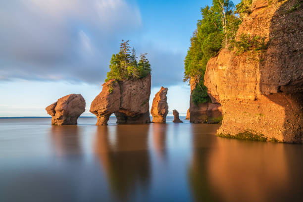 Hopewill Rock at sunrise during high tide, New Brunswick, Canada