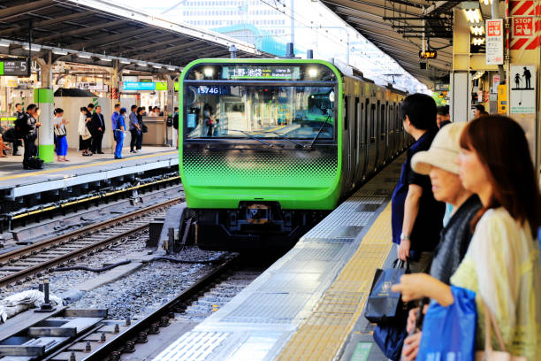 Tokyo, Japan - Aug.03.2019: Passengers waiting for Yamanote Line at Tokyo Station. Passengers are waiting for the trains.
