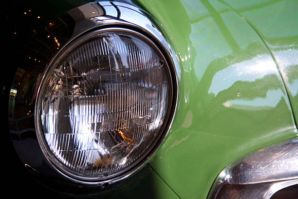 istock Green Vintage Auto Car: focus on Headlight 117324631