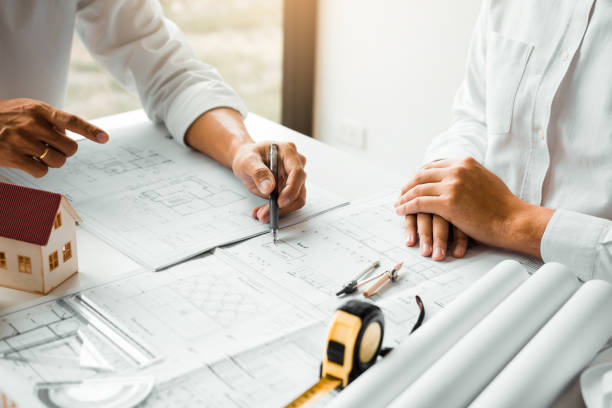 istock The partnership engineering man or co-workers working on a project and discussing together with looking at blueprint paperwork. 1173248189