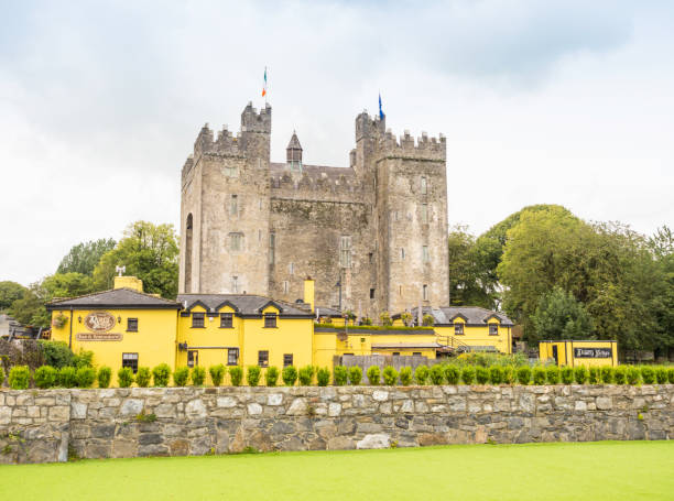 Bunratty, Ireland - August 11, 2019: A view of the historic Bunratty Castle and  Durty Nelly's pub in Bunratty, County Clare, Ireland.