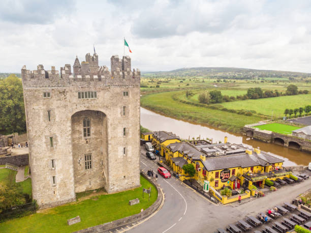 Bunratty, Ireland - August 11, 2019: An aerial view of the historic Bunratty Castle and  Durty Nelly's pub in Bunratty, County Clare, Ireland.