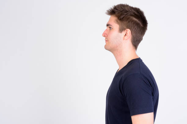 istock Profile view of young handsome man against white background 1173252708
