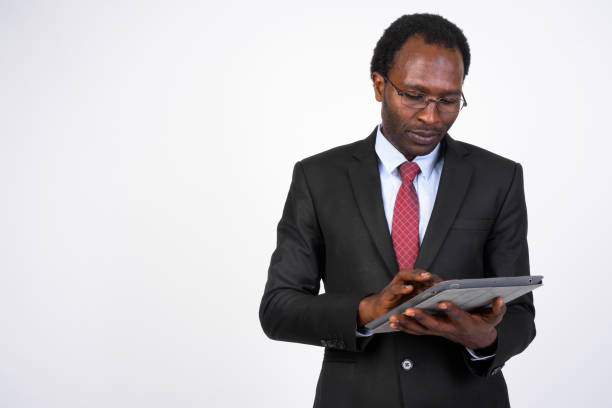 istock Portrait of handsome African businessman using digital tablet 1173255486