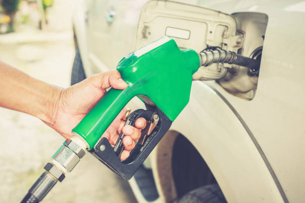 istock Hand refilling worker fuel the car at the refuel station. 1173256846