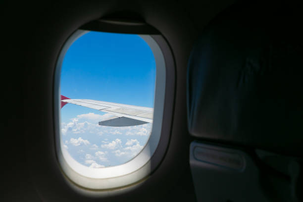 istock View of cloudscape with aircraft on window. 1173257029
