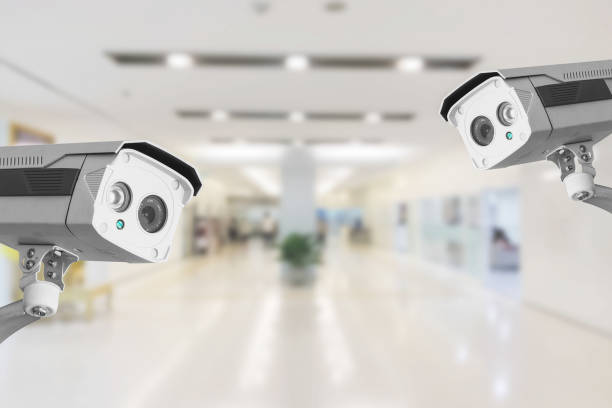 istock CCTV Security Camera operating in hospital on blur background. 1173258155