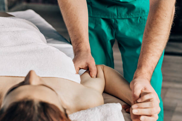 istock A massage therapist doing an elbow massage to a woman close-up. 1173261504