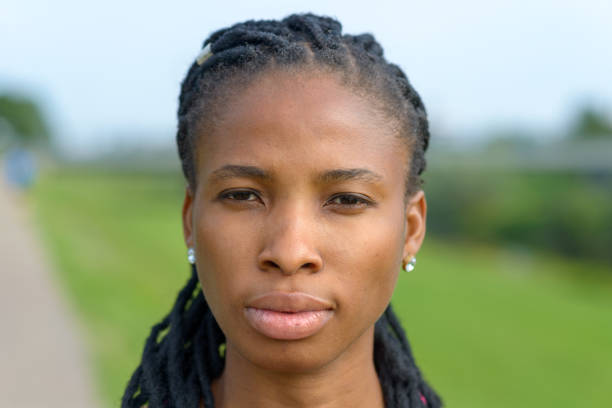 Serious young African woman staring at the camera