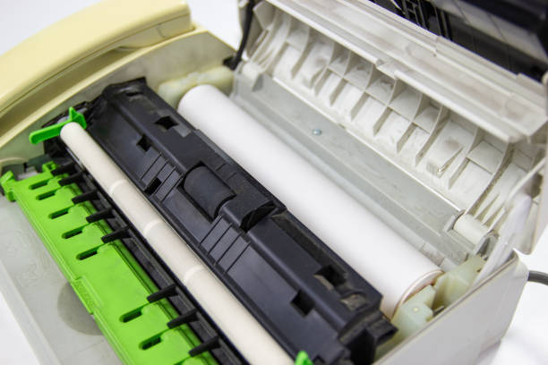 istock Fax machine open with Fax paper put to the fax machine 1173261764