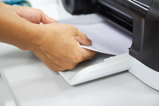 istock hand man lay down the paper from printer in the office, Business concept 1173261809