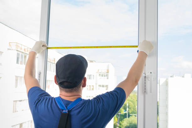 istock a plastic window installation worker measures the light opening of a window using roulette 1173261885