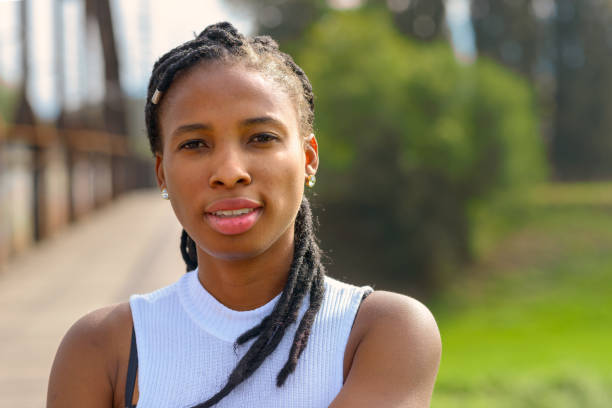 istock Thoughtful young African woman with a quiet smile 1173262541
