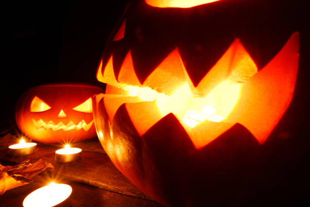 istock Halloween pumpkins and candles 1173262681