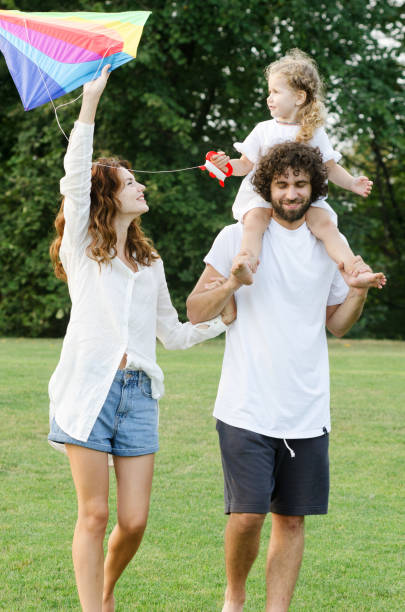 istock Happy young family in the park 1173262810
