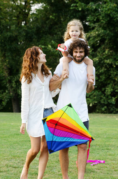 istock Happy young family in the park 1173262813