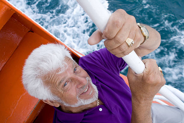 istock Senior man in sailboat 117326691