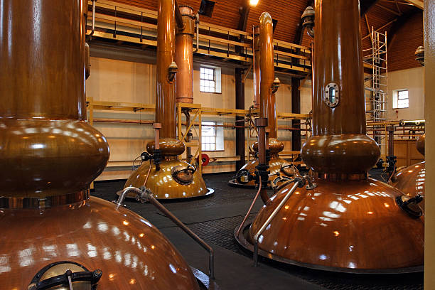 Stills in a whisky distillery Stills in a famous scottish whisky distillery. They are the tallest in Scotland. distillery still photos stock pictures, royalty-free photos & images