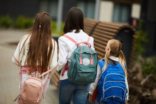 istock Schoolgirls walking outdoors 1173268194