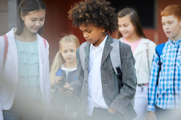 istock African schoolboy using the phone 1173268291