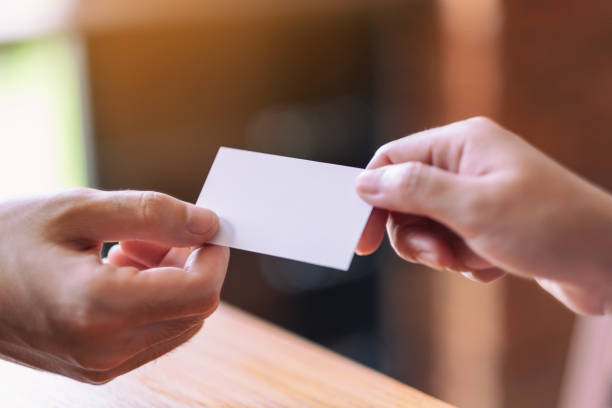 istock businessman holding and exchanging empty business card 1173268981