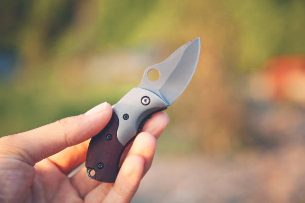 istock man hand pocket knife in nature 1173275489