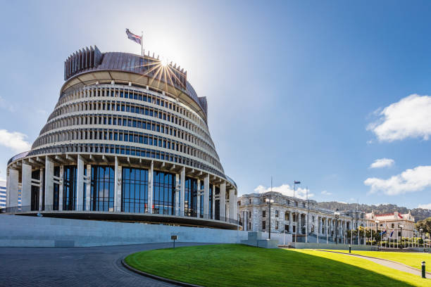 The Beehive Building, New Zealand's Parliament Building, against the Sun with Sunstars. Wellington, North Island, New Zealand, Oceania
