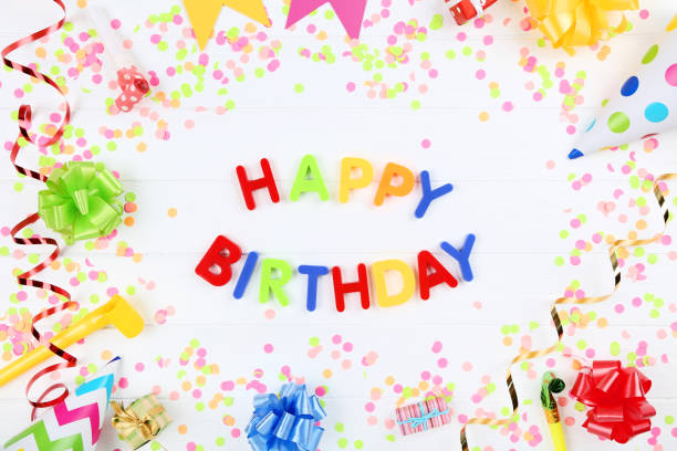 istock Text Happy Birthday by plastic letters with decorations and confetti on white background 1173276295