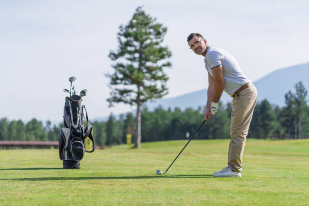 istock Male golfer teeing off 1173278035