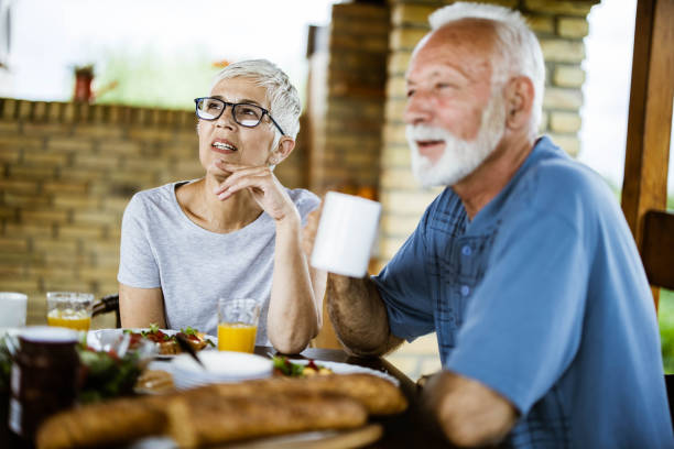 istock Senior couple having their breakfast on a terrace. 1173281249
