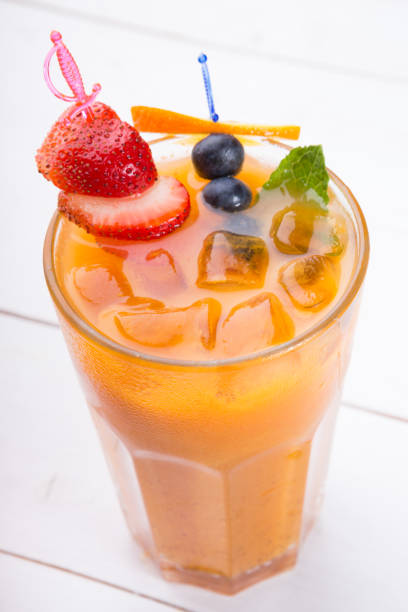 istock Glass of cold orange cocktail 1173281252
