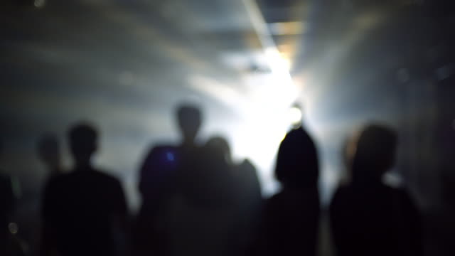 4k Blurred people in the flashing light background
