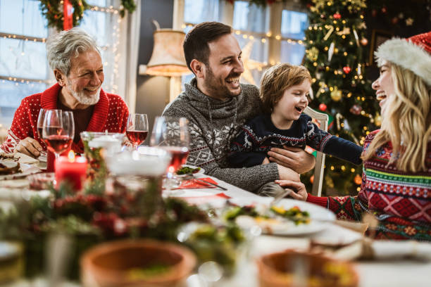 istock Happy extended family having fun during a meal on New Year. 1173282711