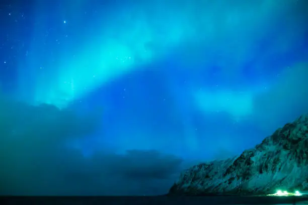 Photo of Amazing and Unique Nothern Lights Aurora Borealis Over Lofoten Islands in Norway, Over the Polar Circle. Horizontal Shot