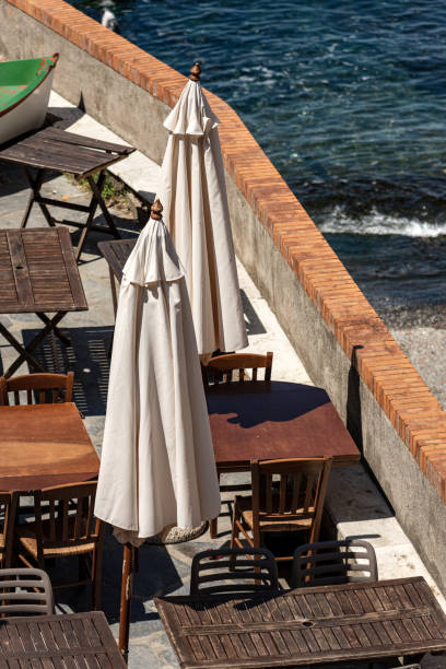 istock Empty restaurant tables and chairs - Liguria Italy 1173282754