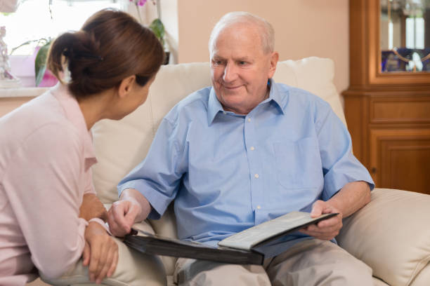 istock Home caregiver – woman helping senior man 1173282988