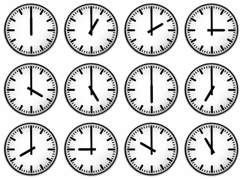 Round clock with black and red pointers isolated on white