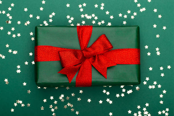 istock Christmas composition. Christmas golden glittering decorations on color background. Flat lay, top view, copy space - Image 1173284415